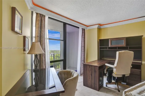 a workspace with furniture and a window