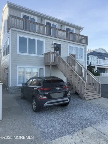 a view of a car parked in front of a building