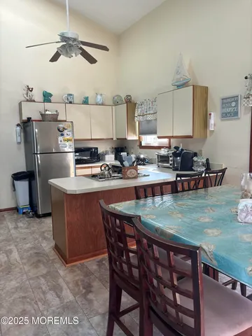 a dining table with chairs and window