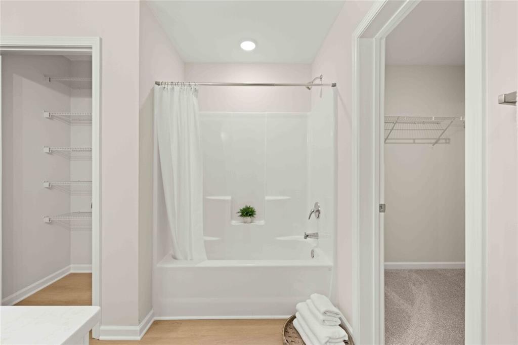 3489 Fairview Road, Unit MAGNOLIA Covington, GA 30016 - Photo 19 of 29 a bathroom with a bathtub shower and toilet