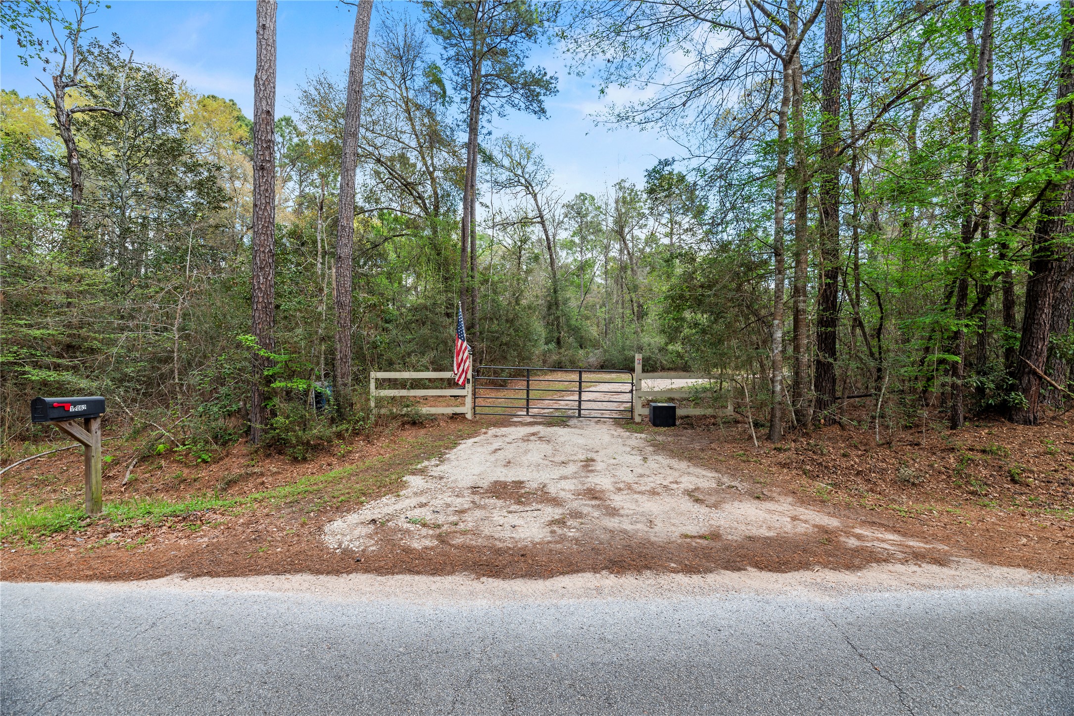 12062 Ike White Road Conroe, TX 77303 - Photo 6 of 37 Access gate to enter property.