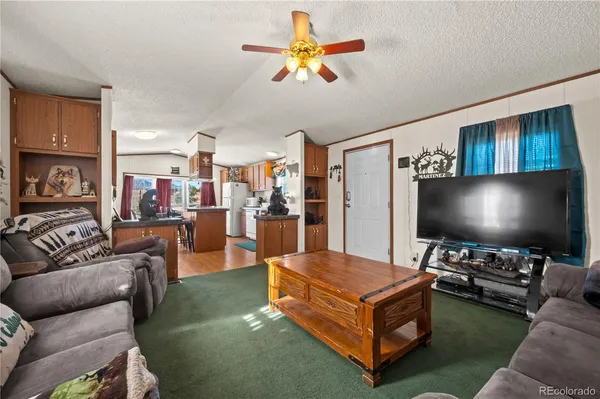 a kitchen with a refrigerator and a stove