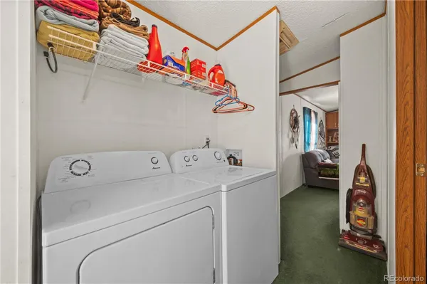 a bedroom with a bed and a large mirror