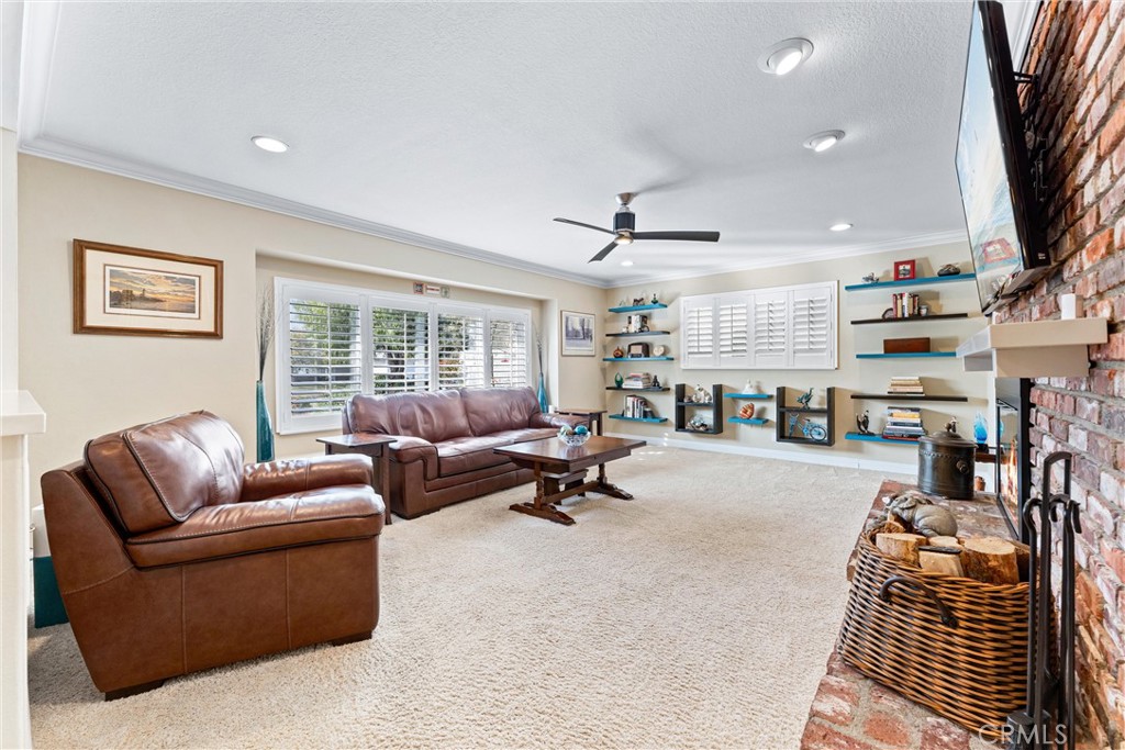 3214 Dakota Avenue Costa Mesa, CA 92626 - Photo 4 of 32 Spacious Living Room with
raised Brick Hearth Fireplace and Built in Shelving, perfect for displaying Artifacts