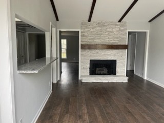 1045 General George Patton Road Nashville, TN 37221 - Photo 1 of 1 a view of an empty room with wooden floor and a fireplace