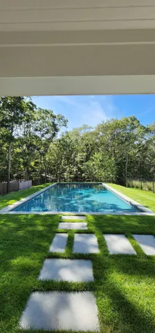 a view of swimming pool with a yard