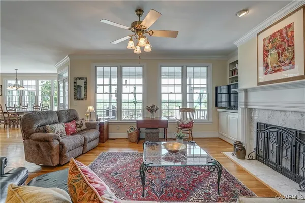 a living room with fireplace furniture and a fireplace