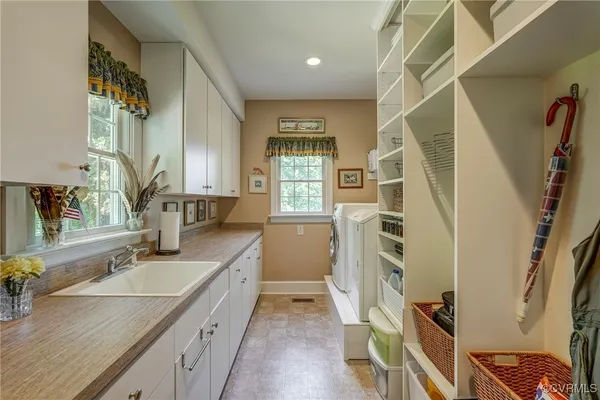 a bathroom with a sink a vanity and a mirror