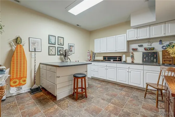 a kitchen with a sink and cabinets