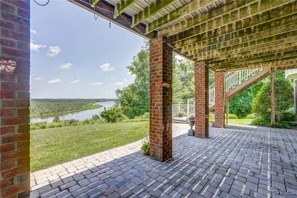a view of a room with a big yard and potted plants
