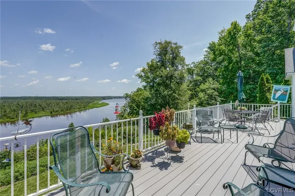a view of balcony with furniture and garden