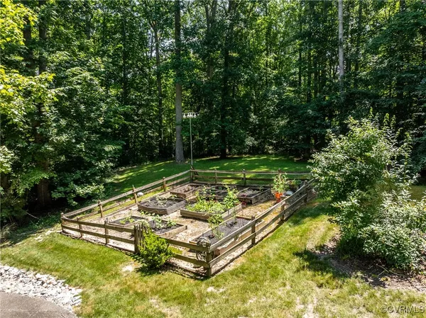 a view of swimming pool with a bench and trees in the background