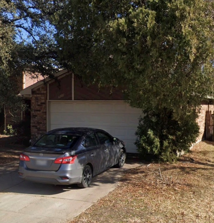 6301 Minuteman Lane Arlington, TX 76002 - Photo 3 of 7 a view of street with parked cars
