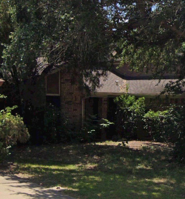 6301 Minuteman Lane Arlington, TX 76002 - Photo 6 of 7 a view of a house with a yard