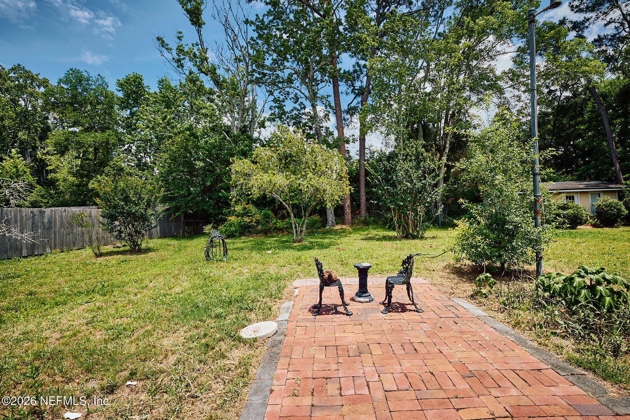 8965 San Rae Road Jacksonville, FL 32257 - Photo 38 of 46 a view of a backyard with sitting area