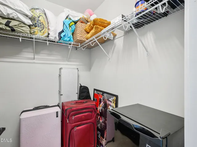 a bedroom with a bed and a cabinets