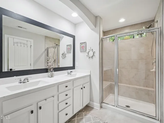 a bedroom with a bed and a table