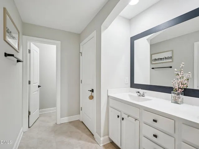 a bathroom with a double vanity sink mirror and double