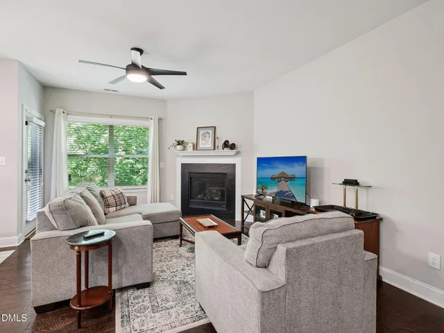 a view of staircase with wooden floor and white walls