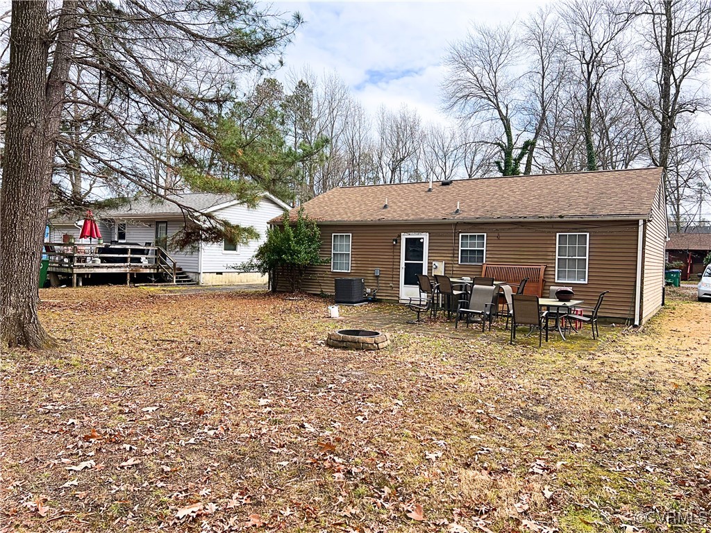 1200 Hodges Road Richmond, VA 23224 - Photo 2 of 23 Back of house featuring central AC, a deck, and an