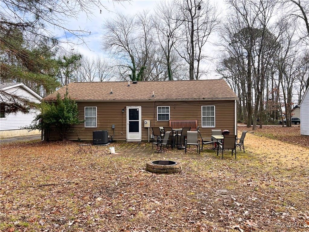 1200 Hodges Road Richmond, VA 23224 - Photo 21 of 23 Back of property featuring central AC unit and a f