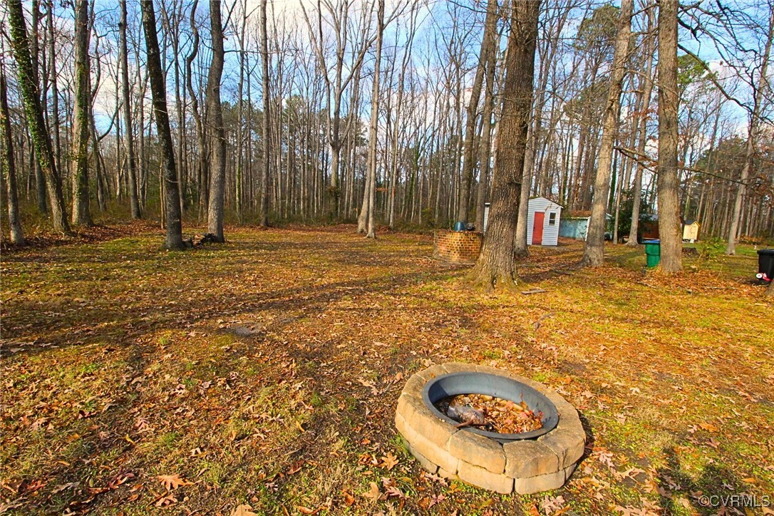 1200 Hodges Road Richmond, VA 23224 - Photo 3 of 23 View of yard featuring an outdoor fire pit and a s