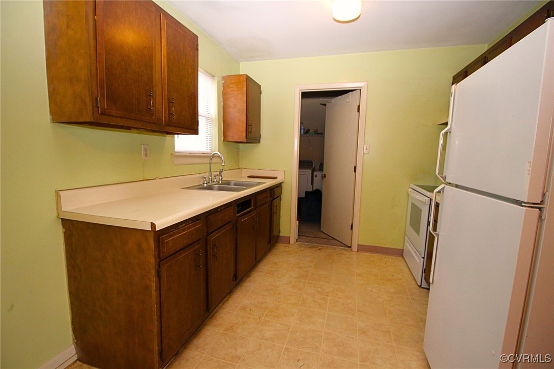 1200 Hodges Road Richmond, VA 23224 - Photo 10 of 23 Kitchen featuring white appliances, separate washe