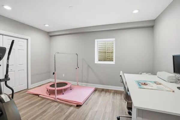 a bed room with a bed and a window
