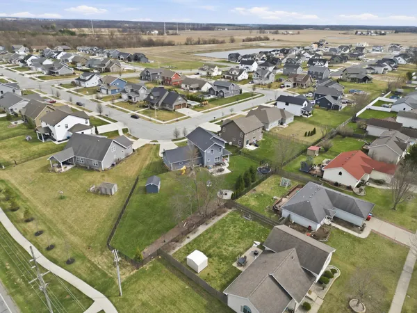 an aerial view of residential houses with outdoor space