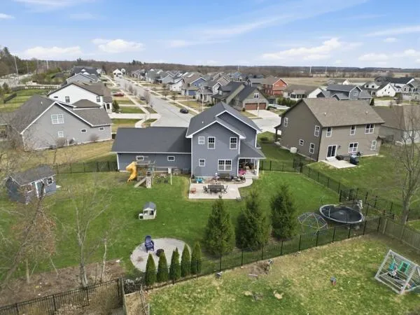 an aerial view of a house with a garden