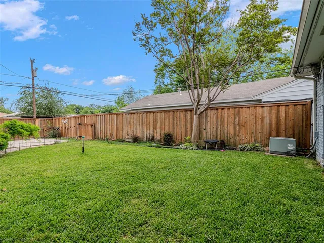 a backyard of a house with lots of green space