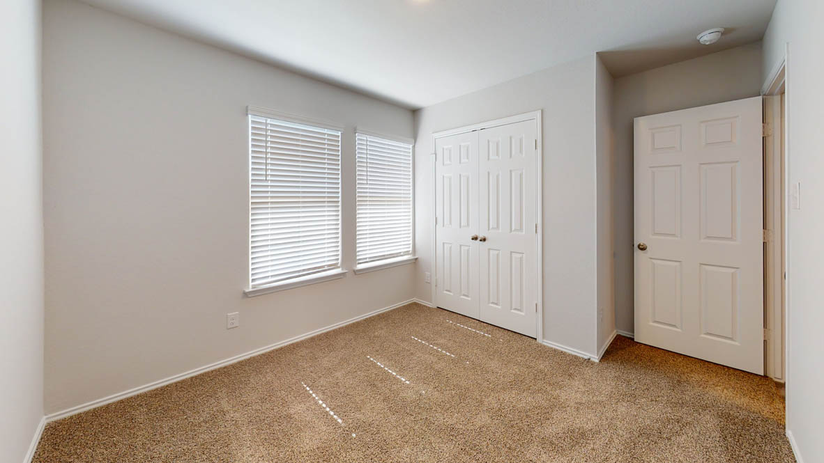 246 Water Wl Road Burnet, TX 78611 - Photo 11 of 16 an empty room with windows