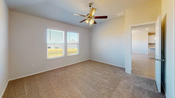 a large kitchen with a wooden floor and stainless steel appliances