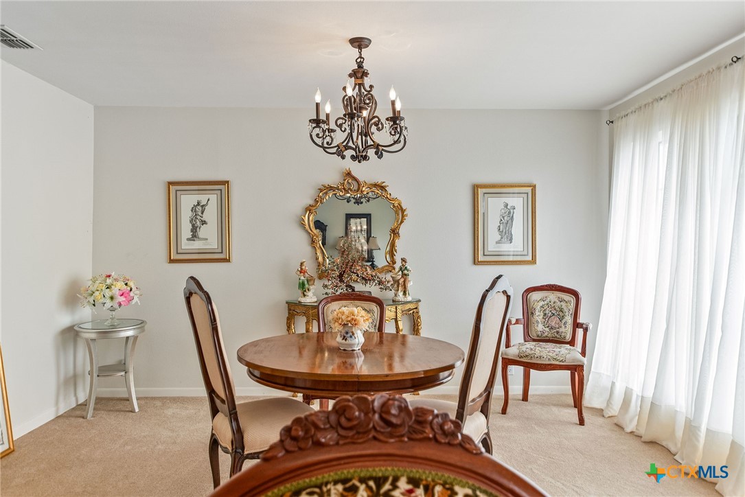 207 Williams Street Tivoli, TX 77990 - Photo 11 of 32 a view of a dining room with furniture and chandelier