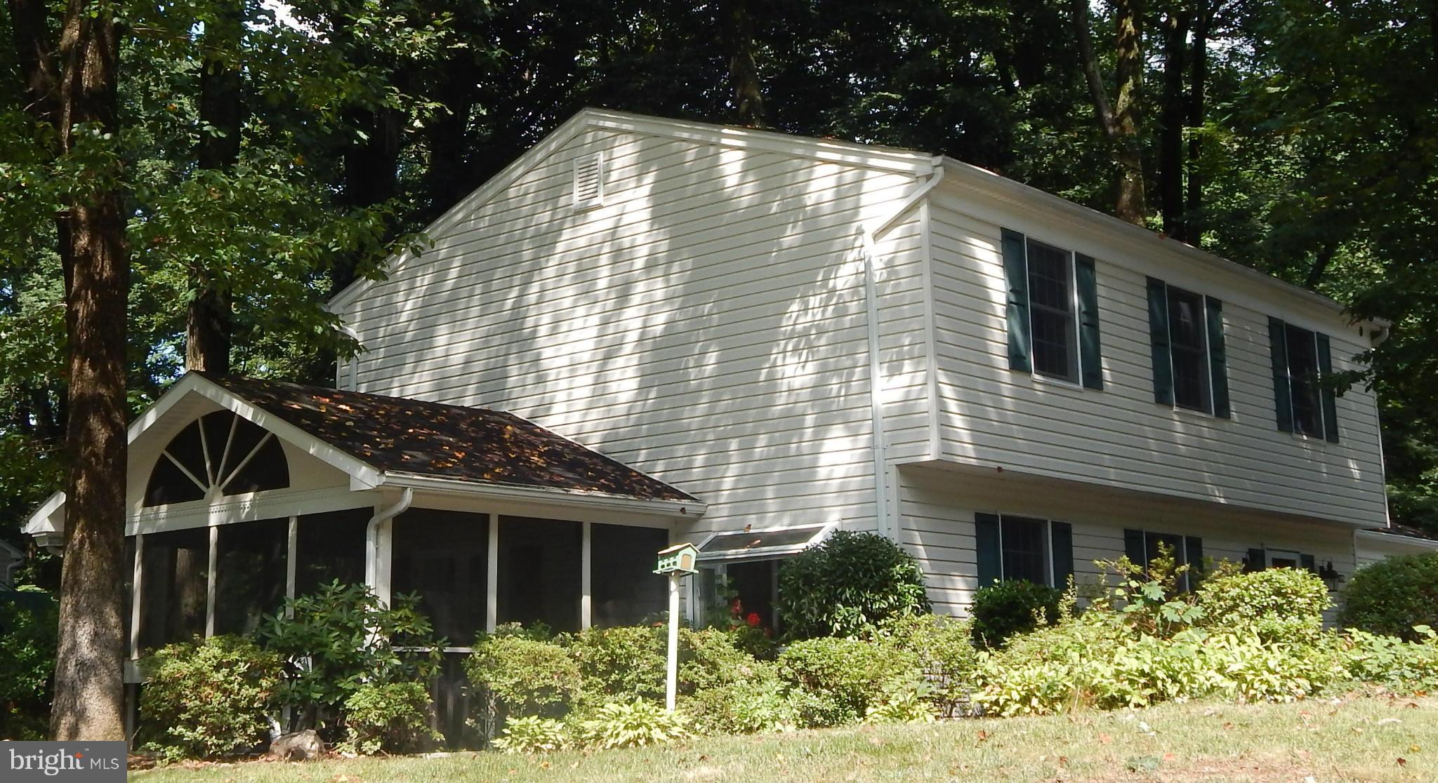 6032 Stevens Forest Road Columbia, MD 21045 - Photo 2 of 29 a view of house with a yard and potted plants