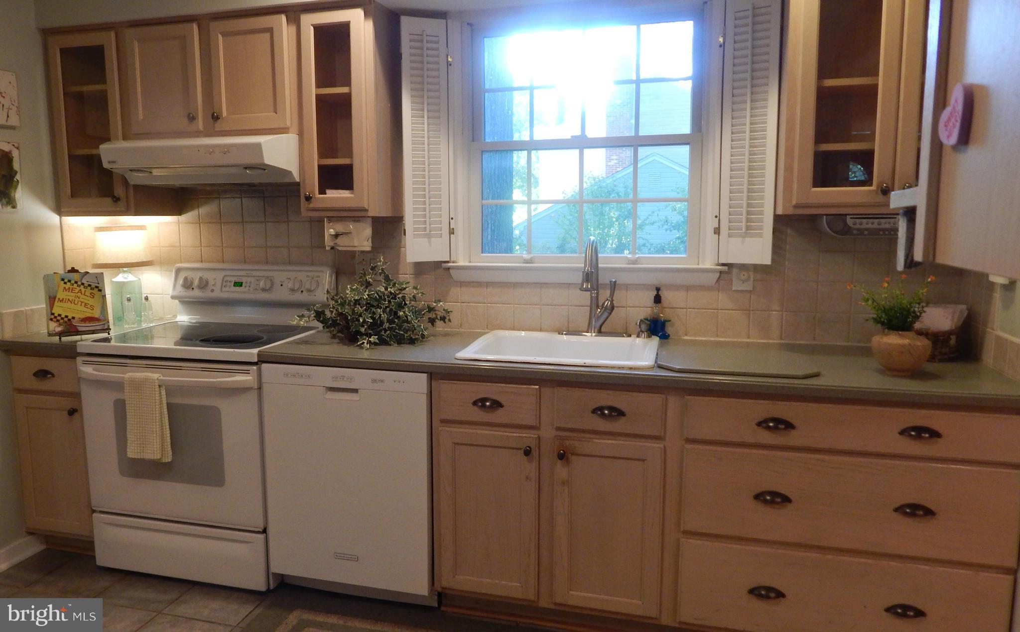 6032 Stevens Forest Road Columbia, MD 21045 - Photo 13 of 29 a kitchen with cabinets appliances a sink and a window