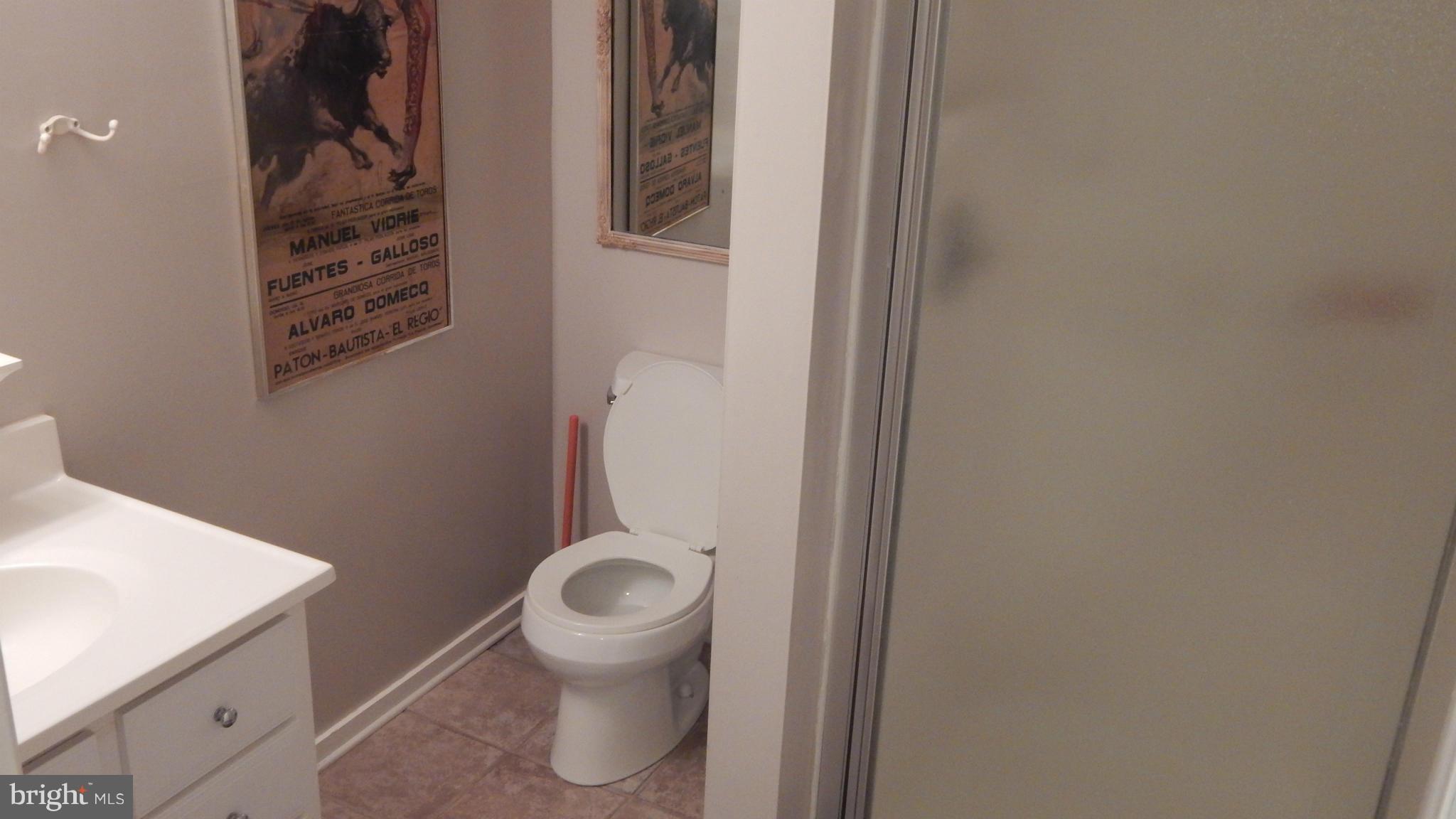 6032 Stevens Forest Road Columbia, MD 21045 - Photo 17 of 29 a bathroom with a toilet and a sink