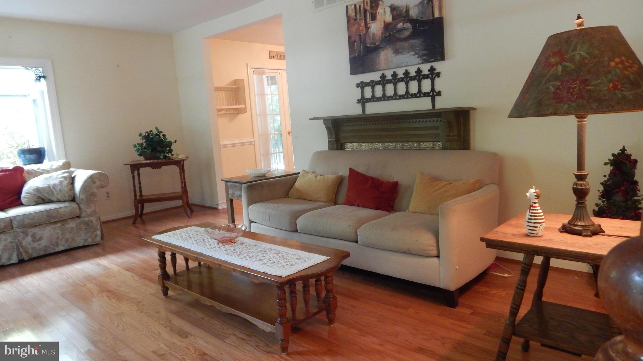 6032 Stevens Forest Road Columbia, MD 21045 - Photo 6 of 29 a living room with furniture and a window