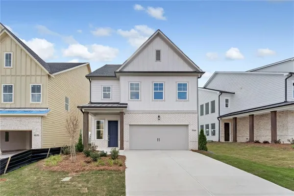 a front view of a house with yard