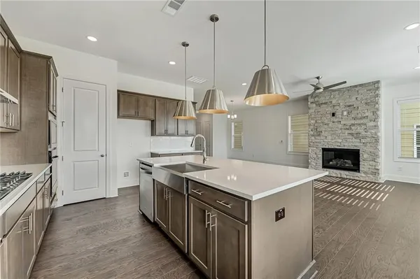 a kitchen that has a lot of cabinets in it