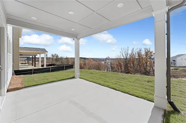 a view of a room with porch and a big yard