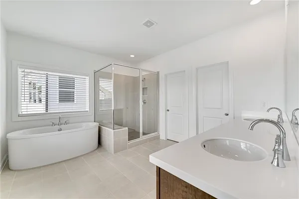 a bathroom with a bathtub and a sink