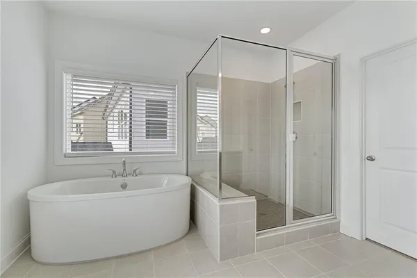 a bathroom with a bathtub and shower