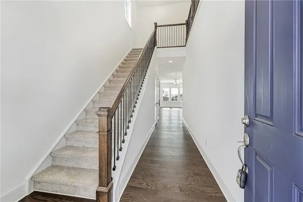 a view of staircase with wooden floor and stairs