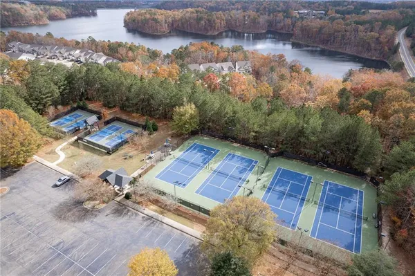 an aerial view of a house with a yard