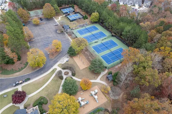 an aerial view of a house a yard and a chair