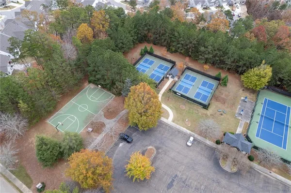 an aerial view of a house with backyard