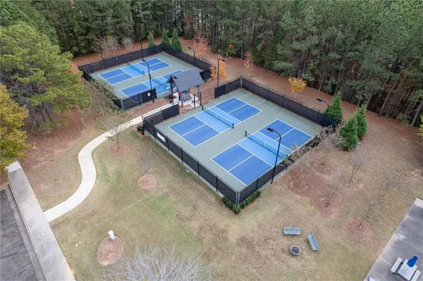 an aerial view of a house with a yard
