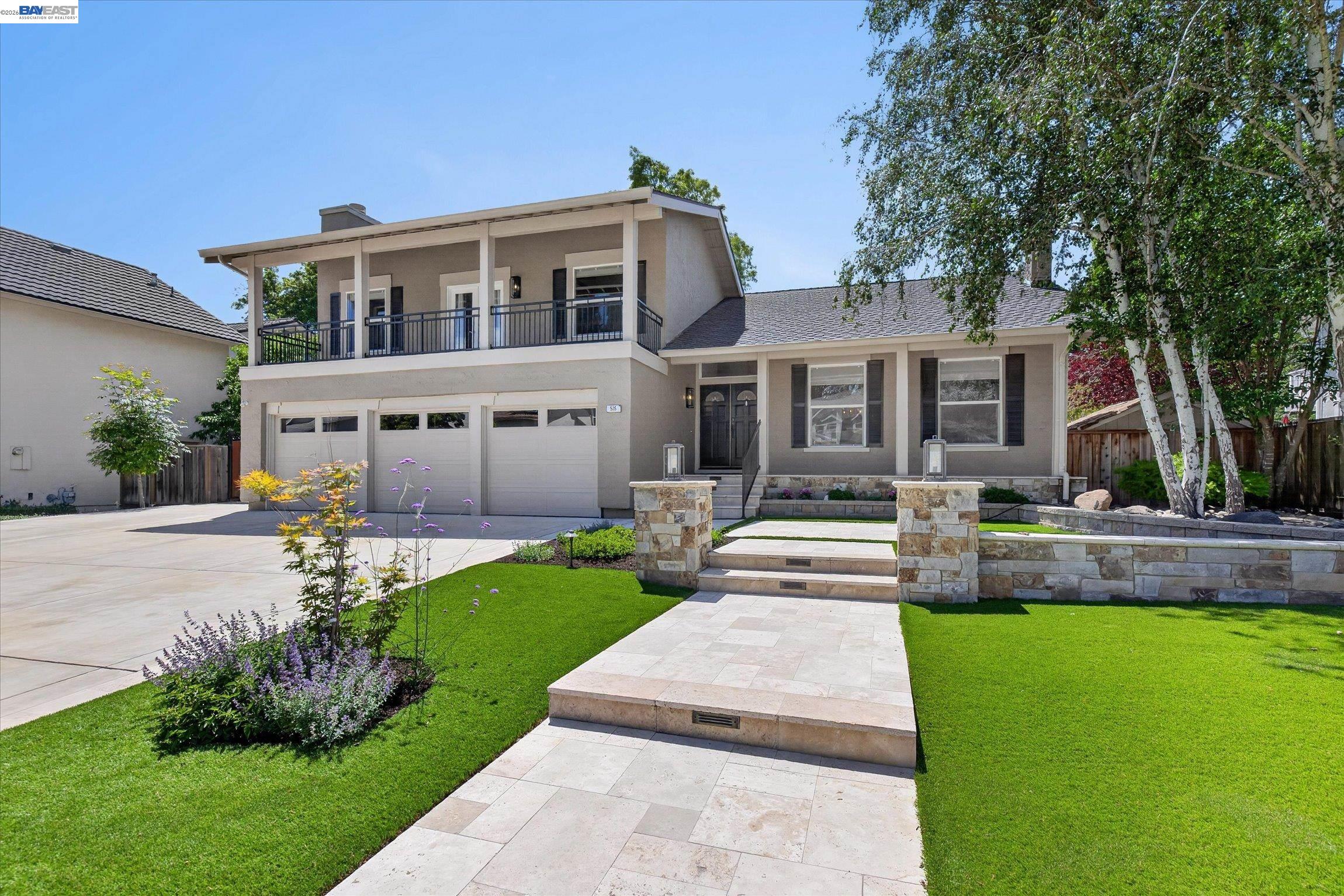 515 Burns Circle San Ramon, CA 94583 - Photo 2 of 49 a front view of a house with a yard and potted plants