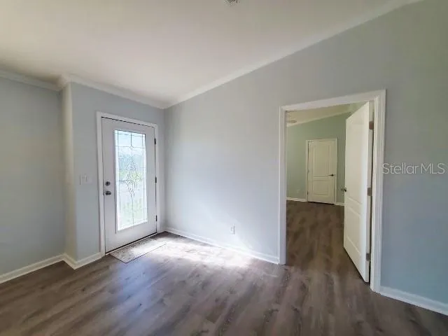 a view of wooden floor in an empty room